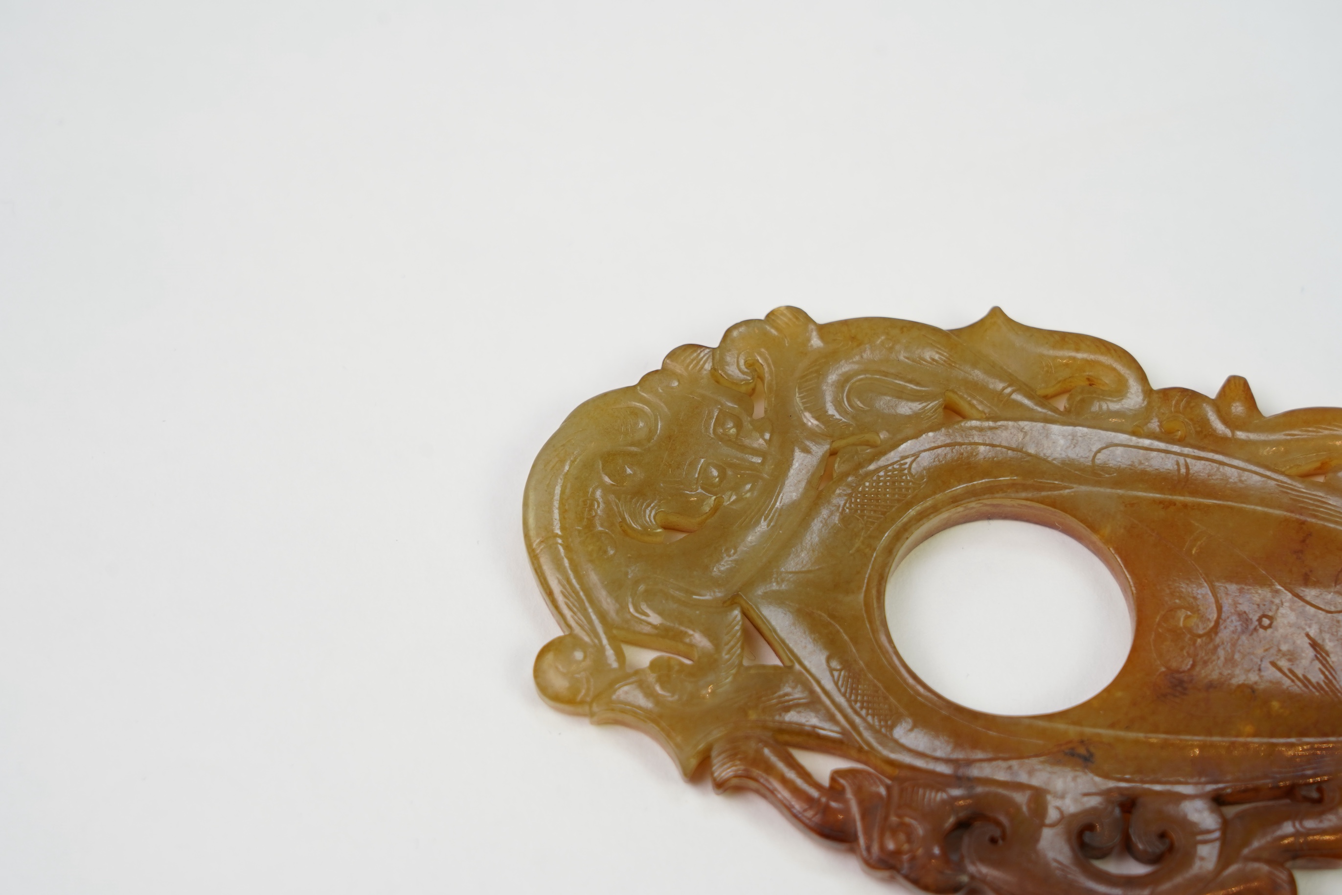 A Chinese archaistic jade plectrum-shaped plaque